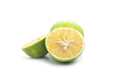 Close-up of lemon against white background