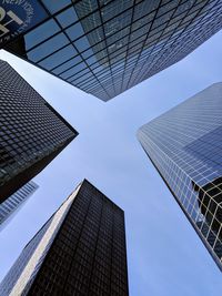 Low angle view of modern buildings against sky