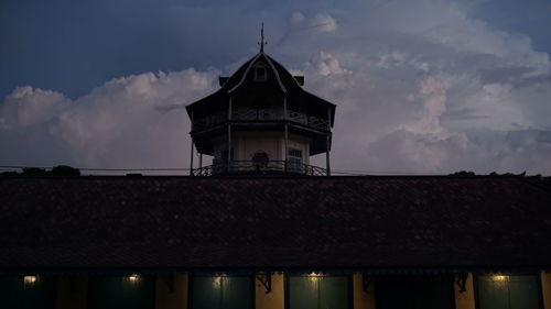 Low angle view of building against sky at dusk