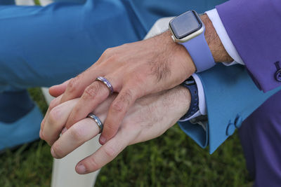 Cropped image of man holding hands