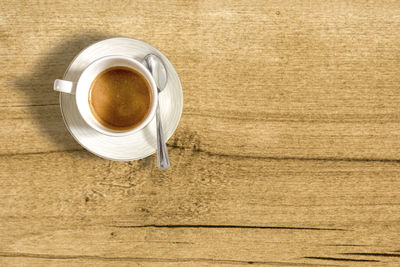 High angle view of coffee cup on table