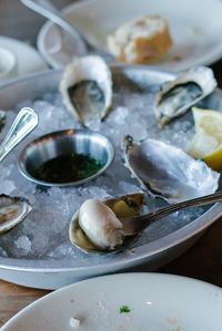 Close-up of oysters on ice in bowl