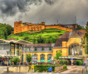 Buildings against cloudy sky