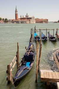 Gondola moored in sea