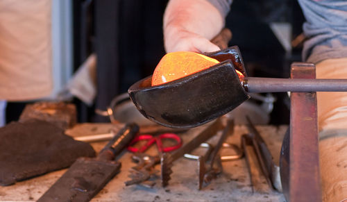 Midsection of man preparing food