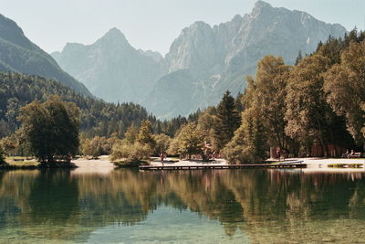 Scenic view of lake and mountains against sky