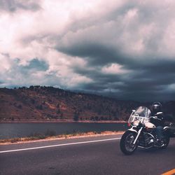 Bicycle on road against sky