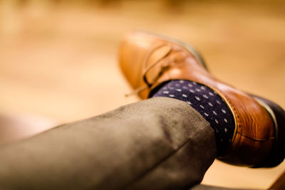 Low section of businessman wearing brown shoe