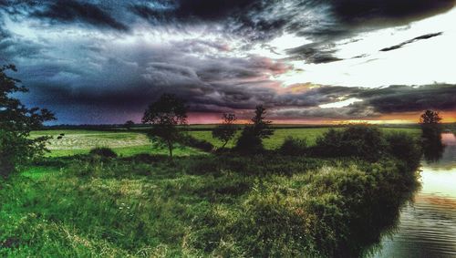 Scenic view of landscape against cloudy sky