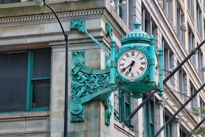 Low angle view of clock on building