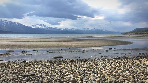 Scenic view of sea against cloudy sky