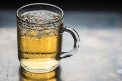 Close-up of beer glass on table