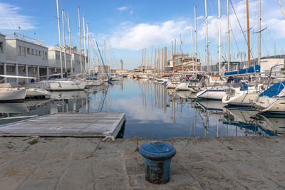 Boats moored at harbor