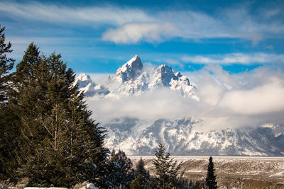 Scenic view of snowcapped mountains against sky