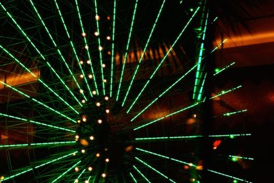 Low angle view of illuminated ferris wheel