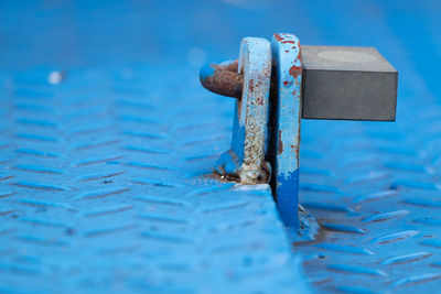 Close-up of rusty metal on wood