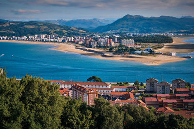 High angle view of townscape by sea