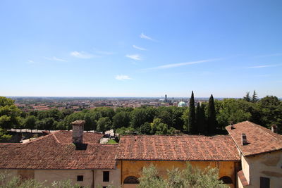 High angle view of townscape against blue sky