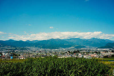 Scenic view of townscape against sky