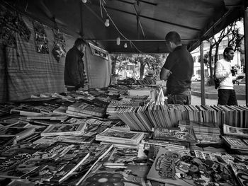 Rear view of man standing at market stall