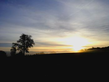 Silhouette landscape against sky during sunset