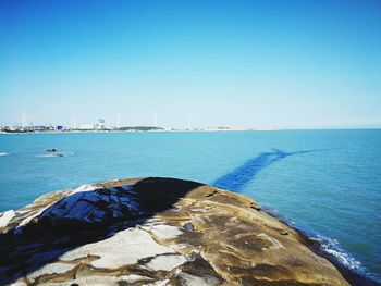 Scenic view of sea against clear blue sky