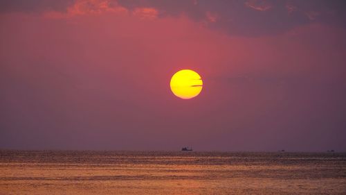 Scenic view of sea against clear sky during sunset