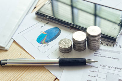 High angle view of coins on table