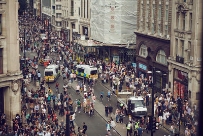 High angle view of people walking on street in city