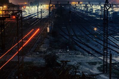 Light trails over railroad tracks at night