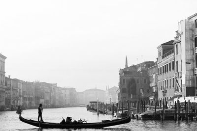 Boats in canal in city