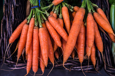 High angle view of carrots on the market stall