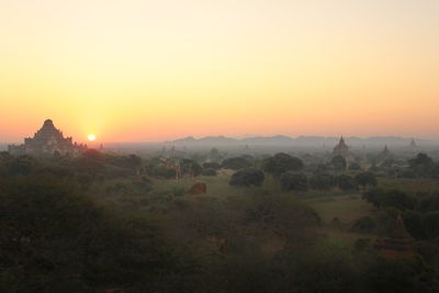 Scenic view of landscape at sunset