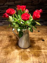Close-up of roses in vase on table