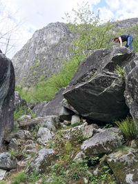 Rocks on cliff against sky