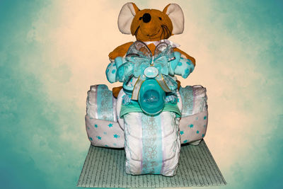 Close-up of gold colored pencils on wall