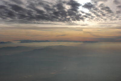 View of calm sea against cloudy sky