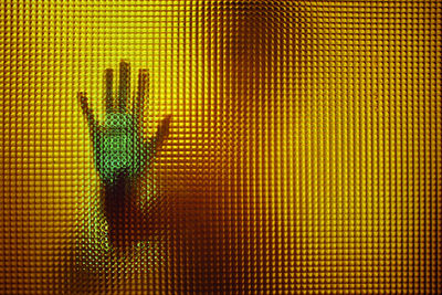 Human hand on glass