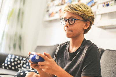 Portrait of teenage boy using mobile phone