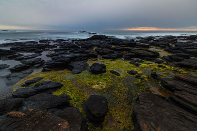 Scenic view of sea against sky during sunset