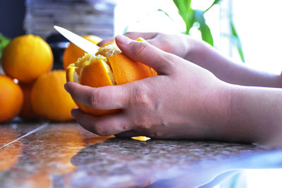 Peeling an orange