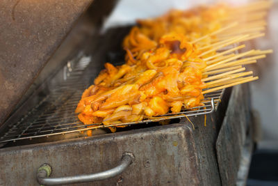 Close-up of meat on barbecue grill