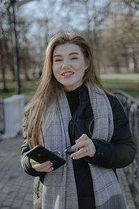 Young woman using mobile phone