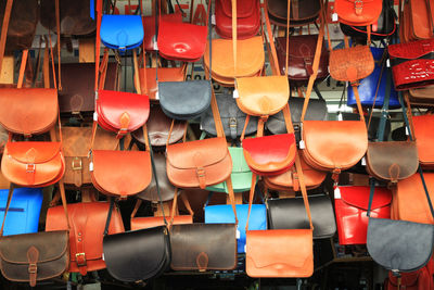 Multi colored umbrellas hanging for sale at market stall