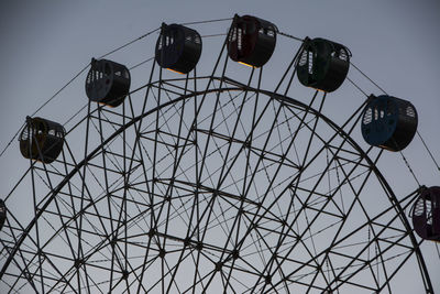 Low angle view of ferris wheel against sky