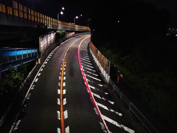 High angle view of light trails on highway at night