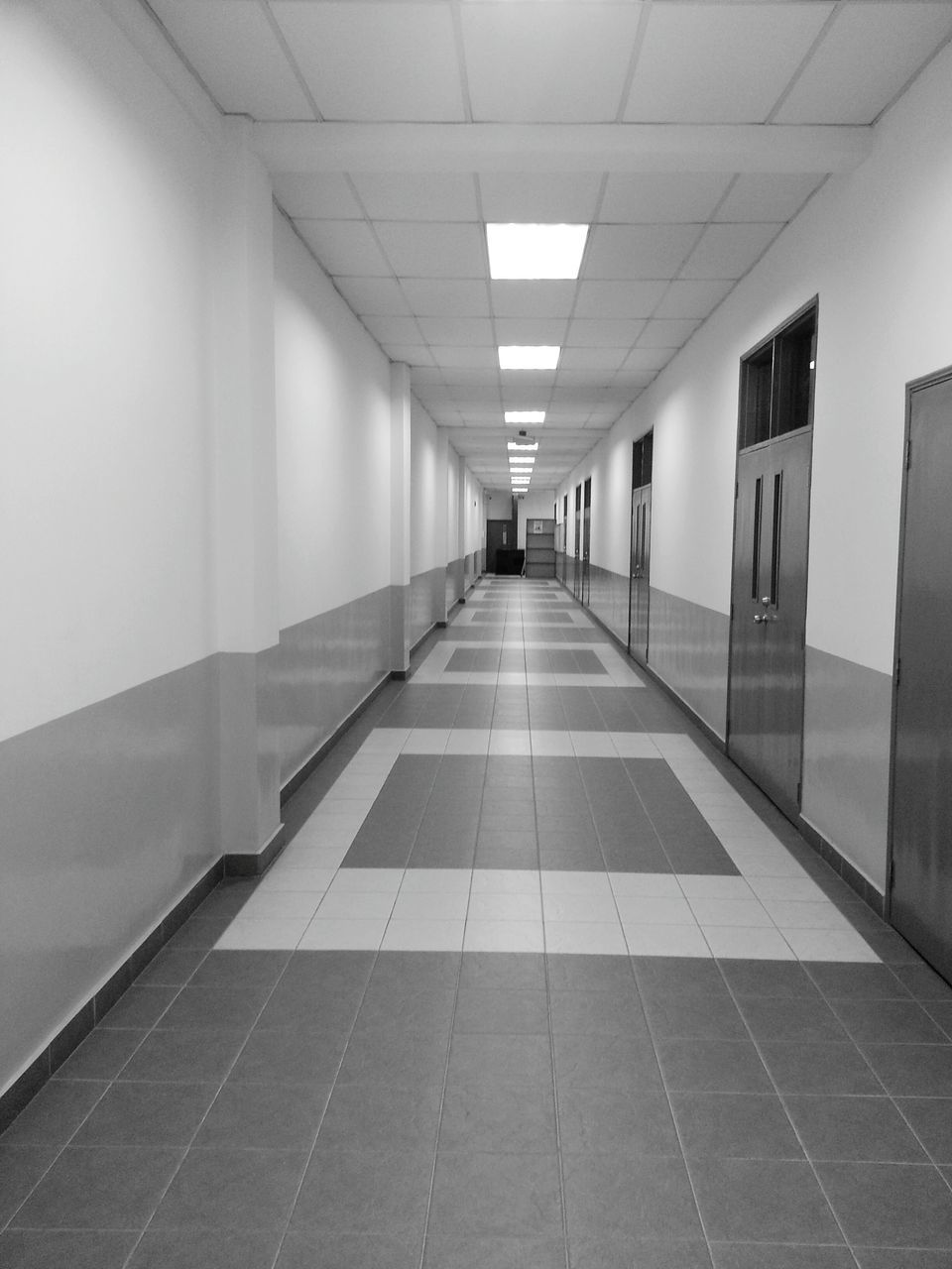 the way forward, architecture, indoors, built structure, diminishing perspective, corridor, ceiling, empty, vanishing point, long, lighting equipment, in a row, narrow, tiled floor, illuminated, building, absence, flooring, walkway, no people