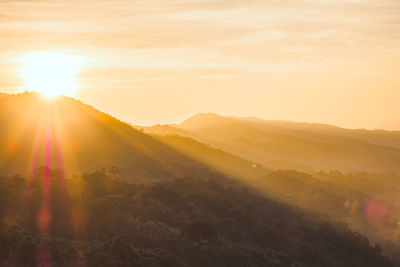 Scenic view of mountains against sky during sunset