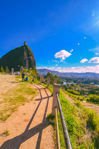 Scenic view of landscape against blue sky