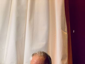 Close-up portrait of man at home